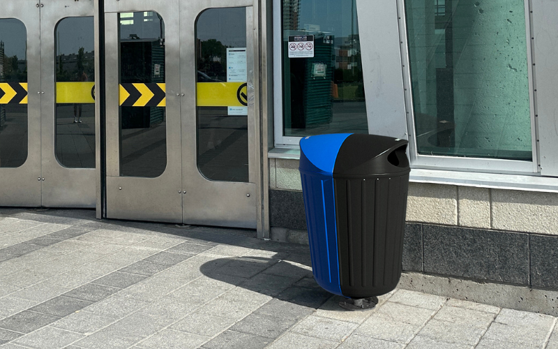 Distrikt rollout bin enclosure in urban sidewalk